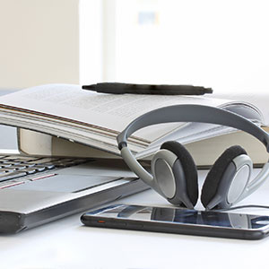 headphones book and laptop