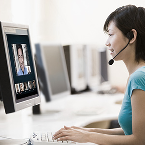 Woman wearing headset in a virtual meeting