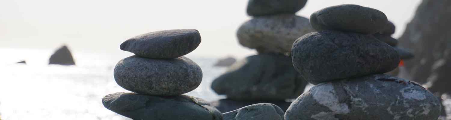 Three stacks of balanced rocks