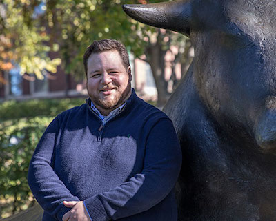 Ben Alfaro in front of the bull sculptures