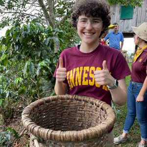 Clara Smith gives two thumbs up as she's about to go coffee picking in Costa Rica,