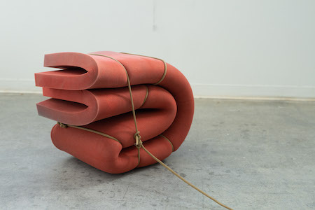 Cody's sculpture of folded foam tied together with a rope