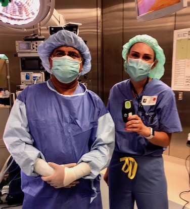 Erin Anderson in scrubs with a colleague