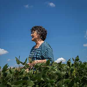 Grace Anderson in soybean field