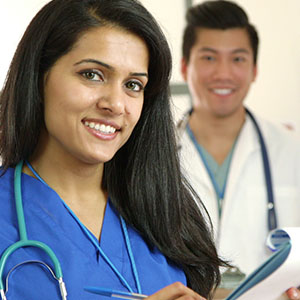 young diverse medical team smiling at camera