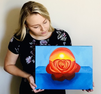 Kaylah Vogt with orange and blue floral painting