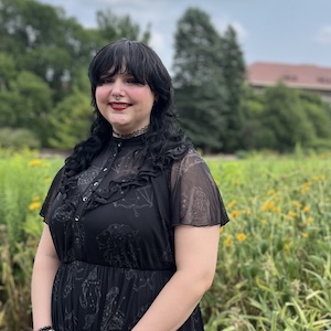 Kendra White in front of yellow flowers in St Paul