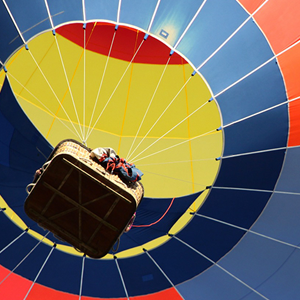 A view of a hot air balloon from below
