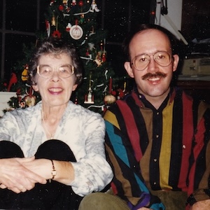 Norma and Ed Peterson sit in front of a Christmas tree