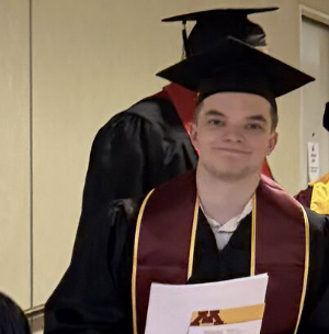 Peter Wolanyk backstage in his graduation cap and gown