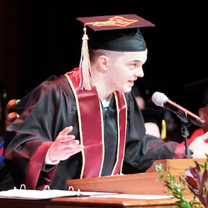 Peter Wolanyk gives his commencement speech on stage