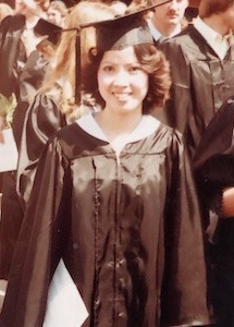 Thuy Luu in cap and gown at her graduation from college