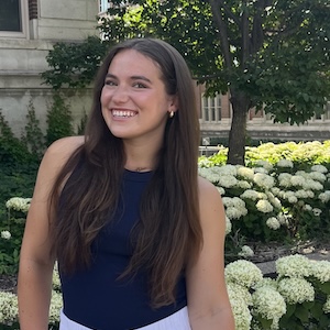 Alex Rapp in front of white hydrangea bushes