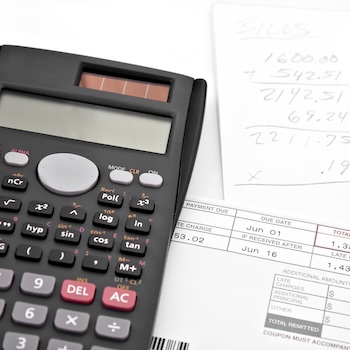 Calculator and papers on a desk