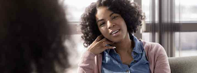 A client speaks with their counselor
