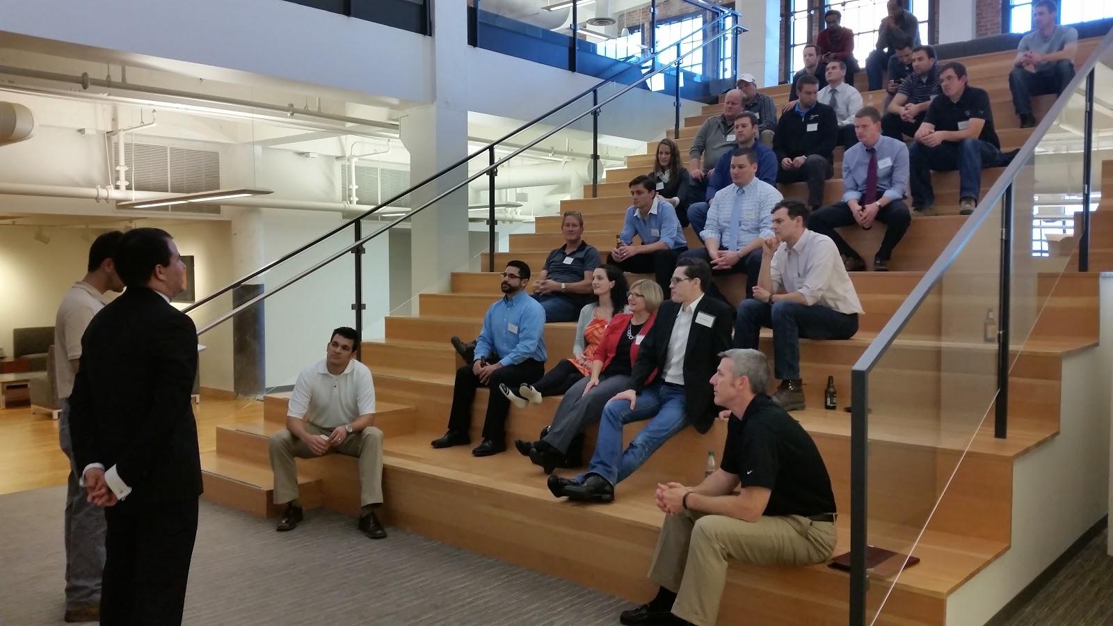 a group of construction management students gather on a wide open stairway platform