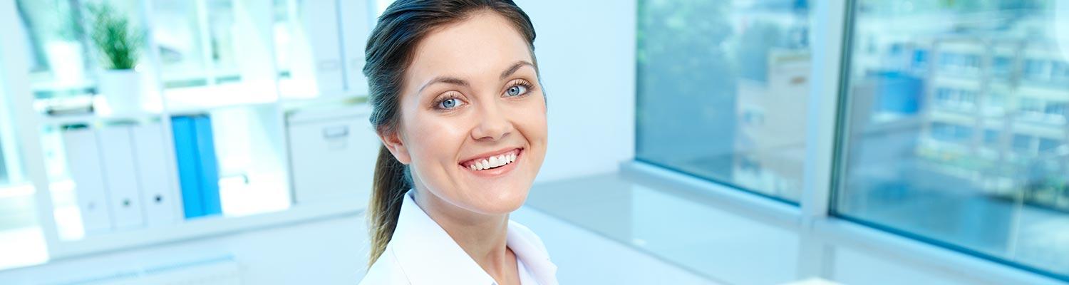  image of smiling woman in a clean bright office