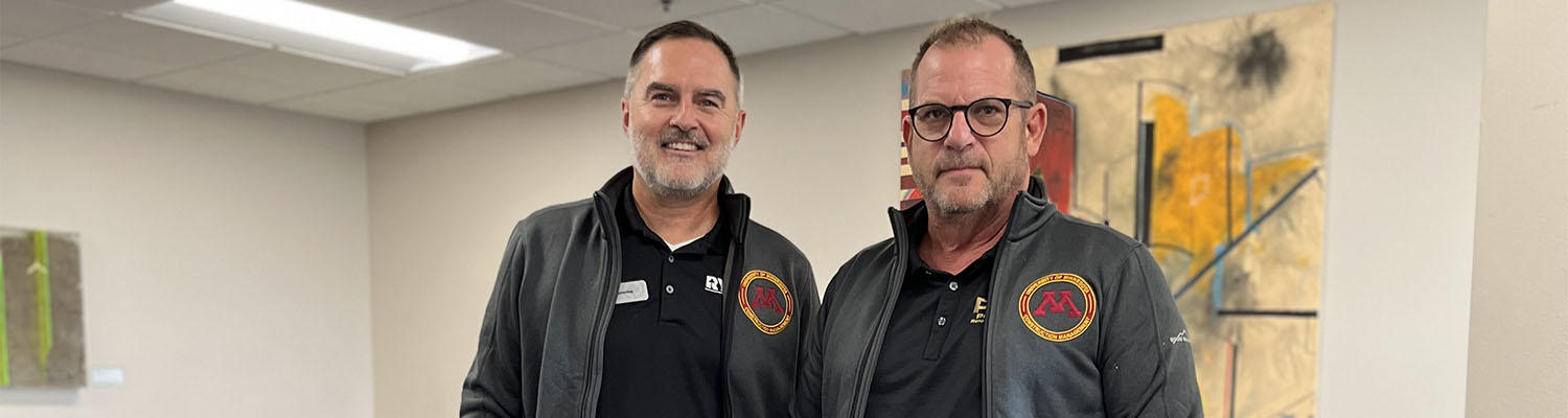 Bill Scherling & Andrew Shetter pose in recently gifted CMGT branded fleece jackets