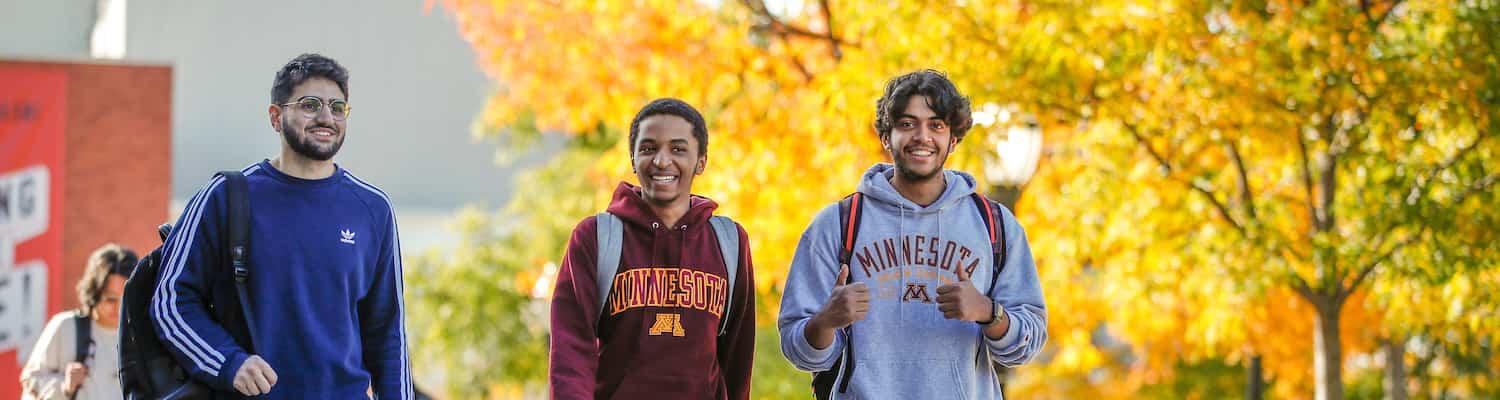 Three U of M students walking across campus