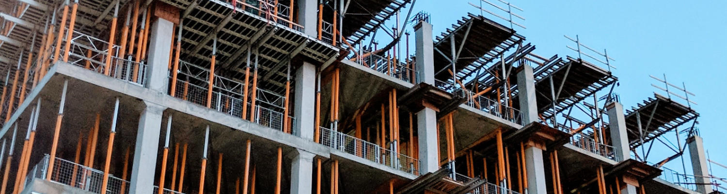 exposed beam structural support for a building under construction